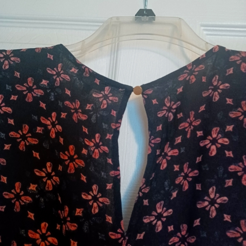 Dress.  Brand is eyeshadow  Size LG  Color is Black/Rose